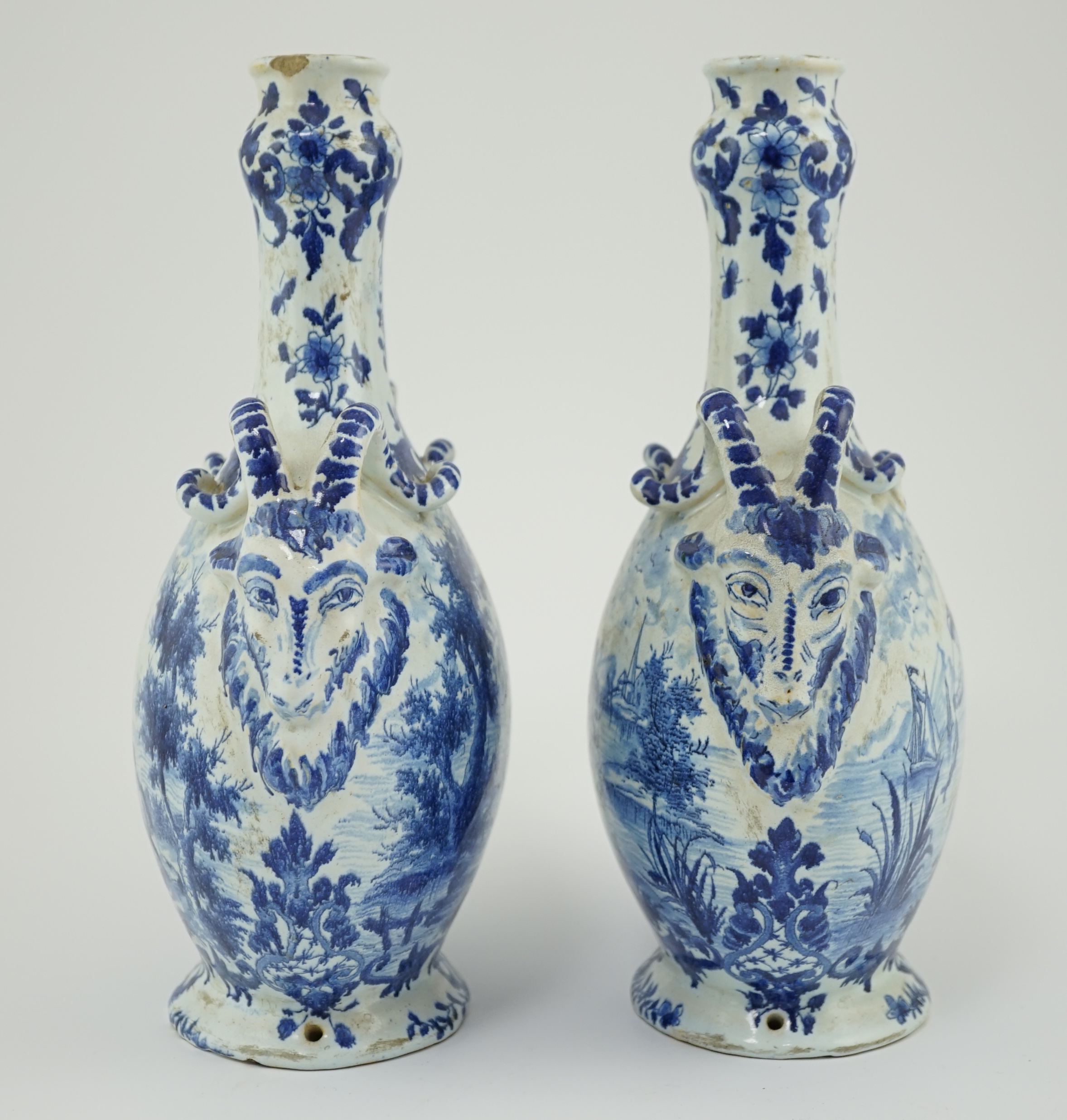 A pair of mid 18th century Delft blue and white flagons